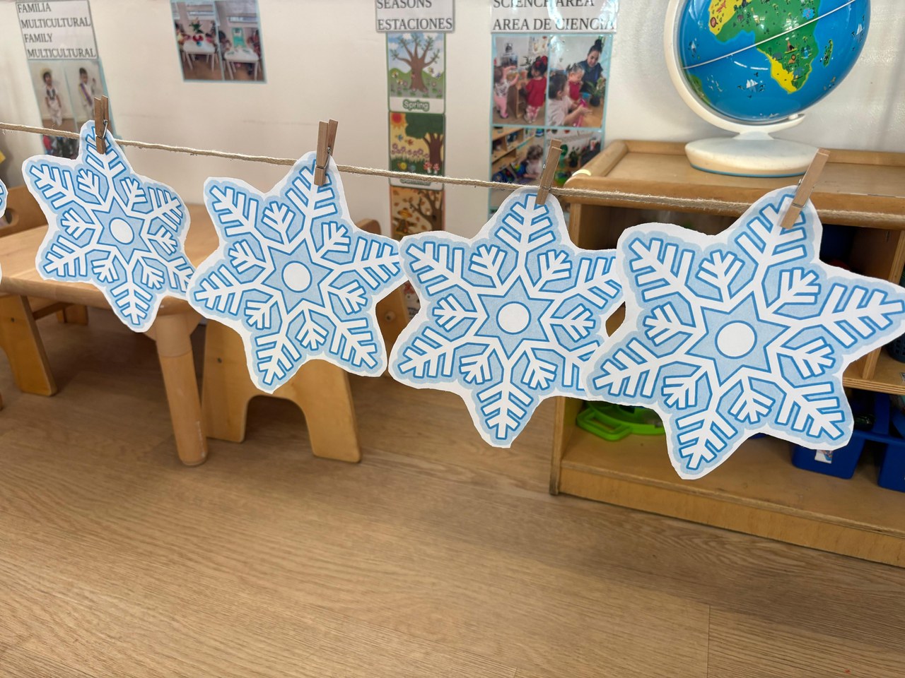 Paper snowflakes strung up for a winter display.